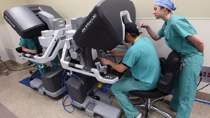 IMAGE: Surgical residents Brittany Solis, right, and Matthew Roberts hone their skills with the new Da Vinci Xi robotic surgical system at Central Arkansas Veterans Healthcare System. (VA photo by Jeff Bowen.)