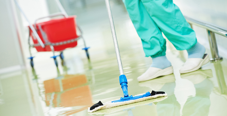 Picture of anhousekeeping Aide sweeping the floor