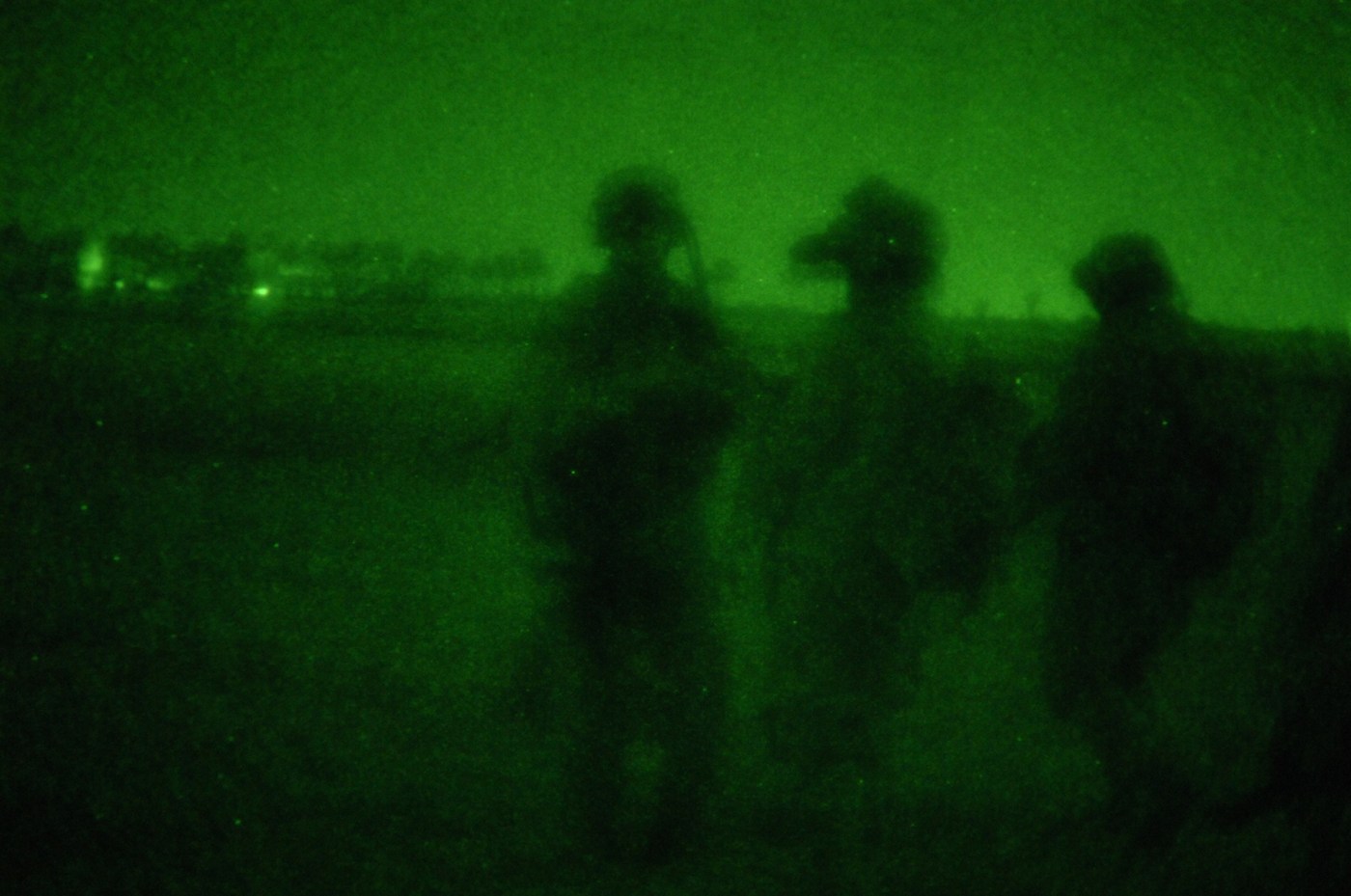 Night vision photo of three Army soldiers' silhouettes