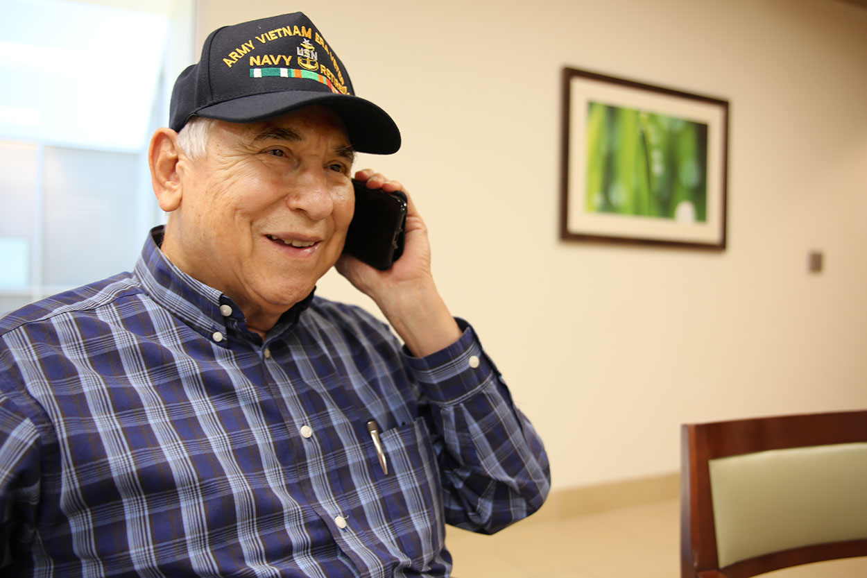 Retired Navy Senior Chief Petty Officer Joe Calvillo smiles after confirming an upcoming VA appointment with the help of a staff member from the call center for the VA Texas Valley Coastal Bend Health Care System (VCB) on February 8, 2019.