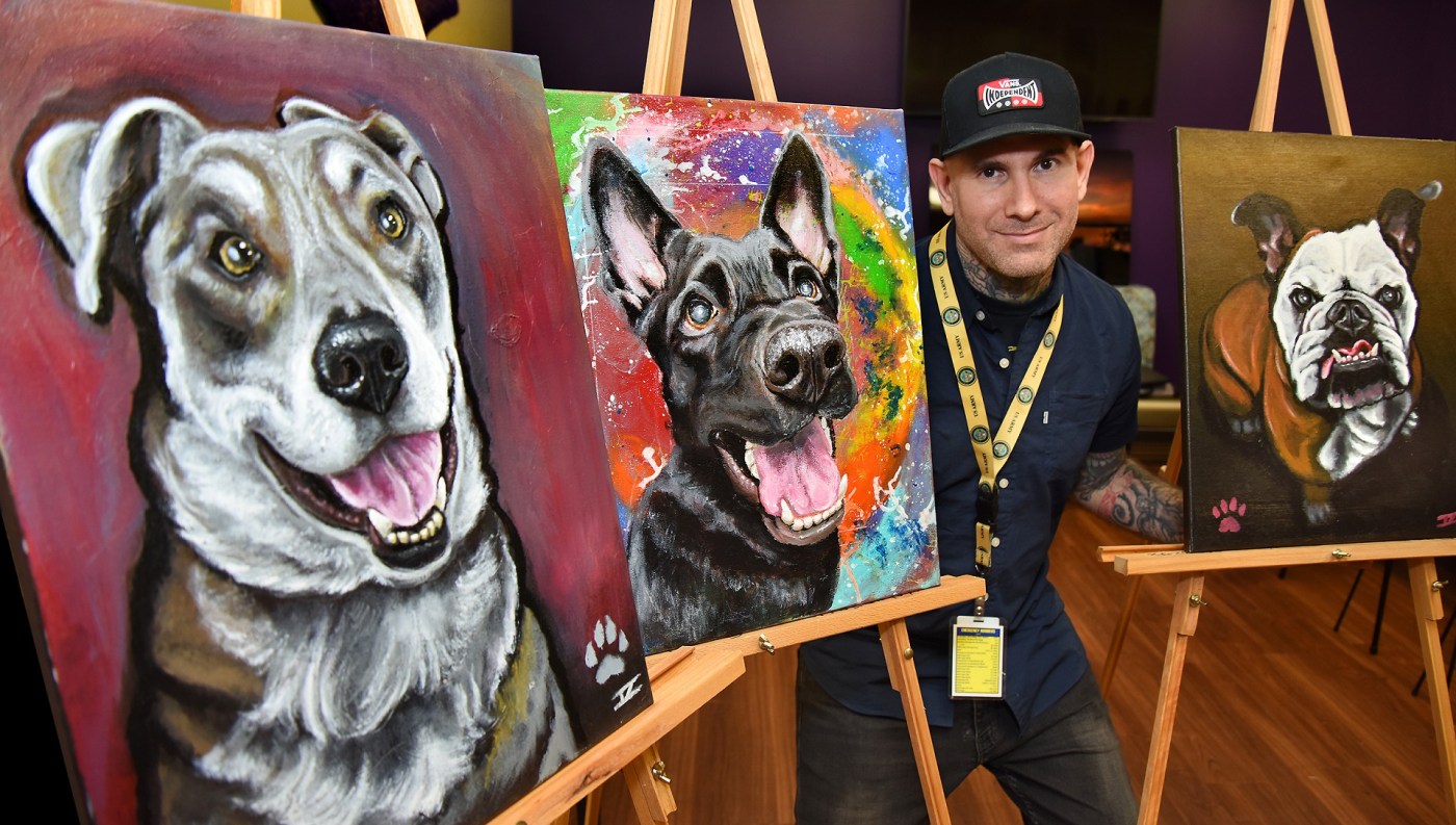 Portrait of Issac Zomaya with his artwork