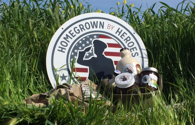 homegrown by heroes logo in field with products