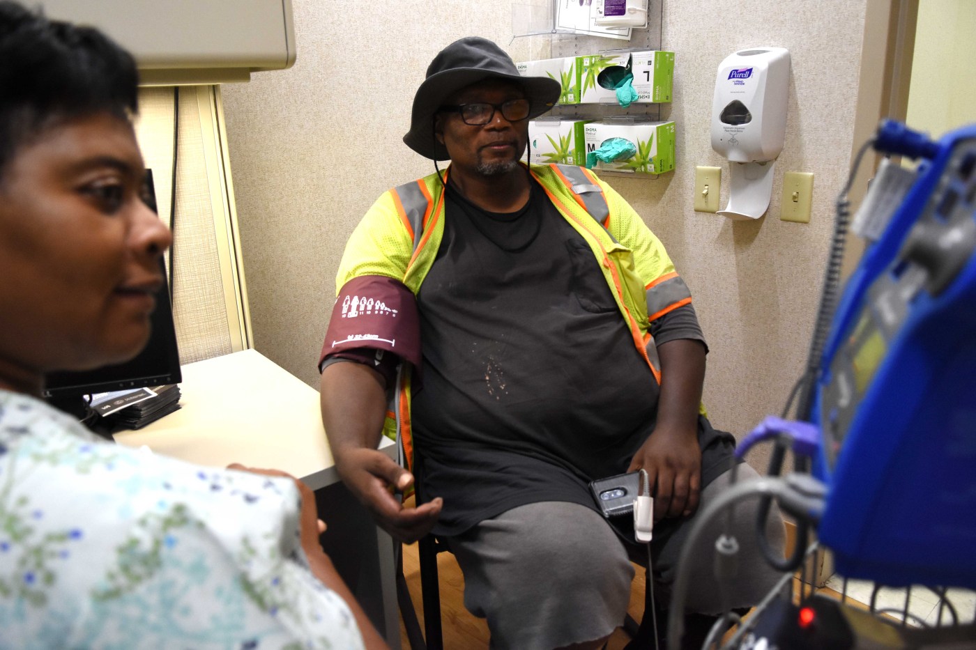 Veteran at Dallas' Bravo Clinic getting his vitals checked thanks to after-hours appointment times.