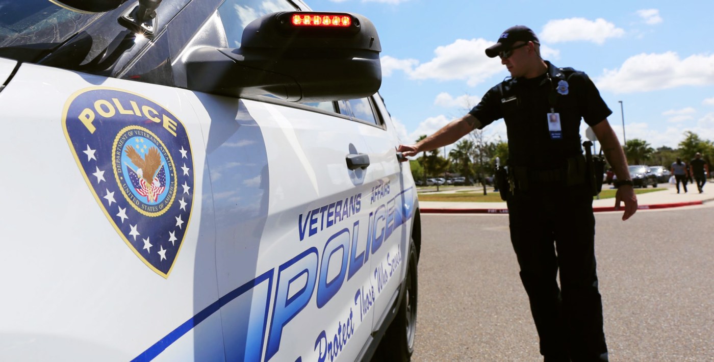 VA Police Officer opens door to his patrol vehicle