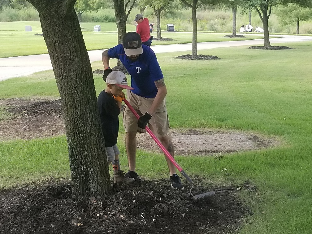 Father and son volunteer with VetServe at national cemetery