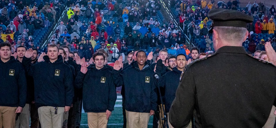 Army Chief of Staff Gen. James C. McConville swears in enlistees at the Nov. 24 Salute to Service game.