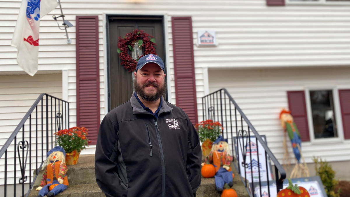 Army Veteran and Vet Center outreach technician Craig Hall in front of his newly renovated home in Glastonbury, Connecticut.