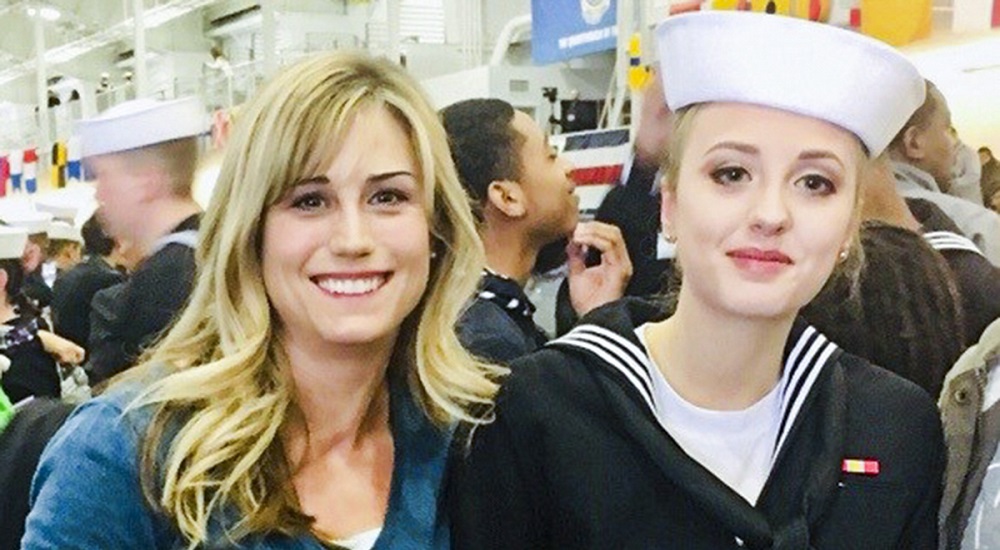A woman and her in-uniform Navy daughter