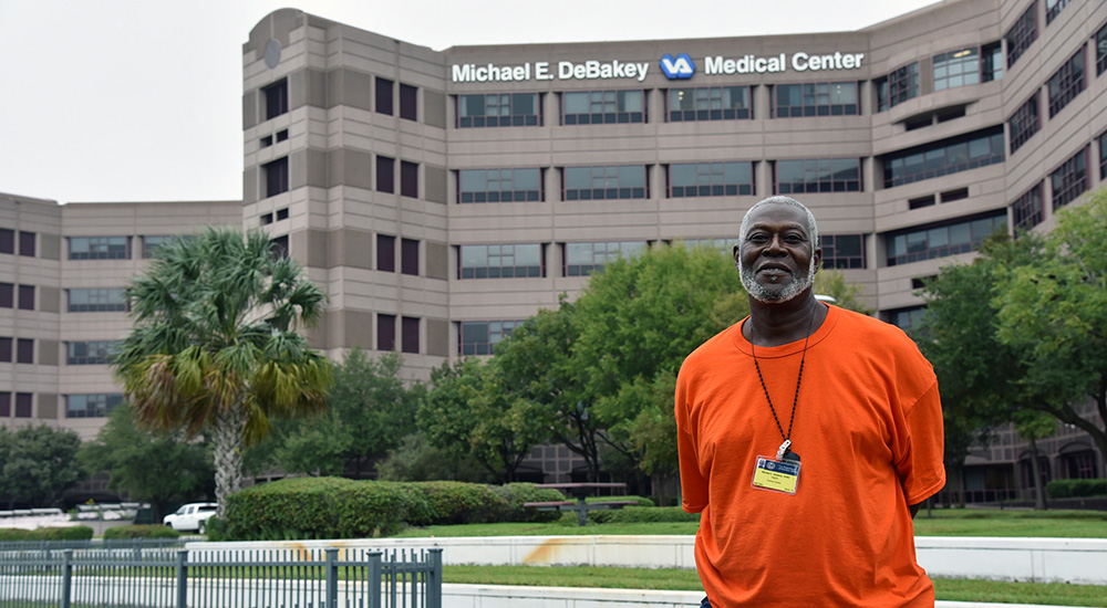Lonnie Conerly stands in front of a VA hospital, where he traveled his road to recovery