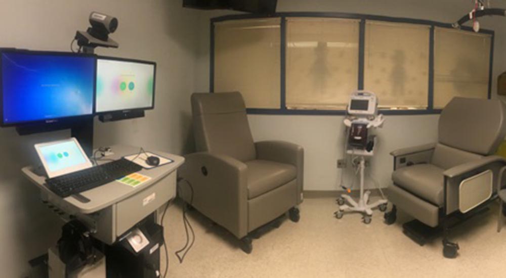 Chemotherapy treatment room with chairs and computer work station