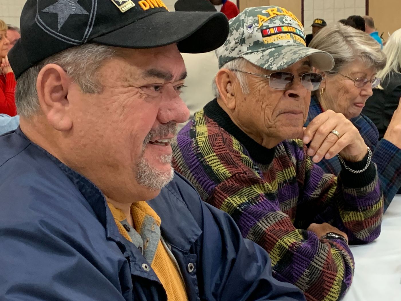 Veterans talk at the Christmas luncheon put on by the Fayetteville Vet Center Dec. 13, 2019.
