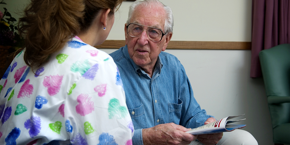 An elderly patient consults with his doctor