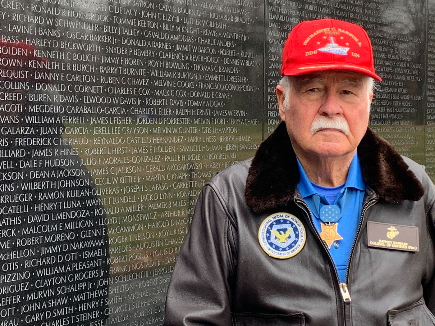 Medal of Honor recipient and Marine Veteran Barney Barnum stands in front of the Vietnam Wall in Washington, D.C.