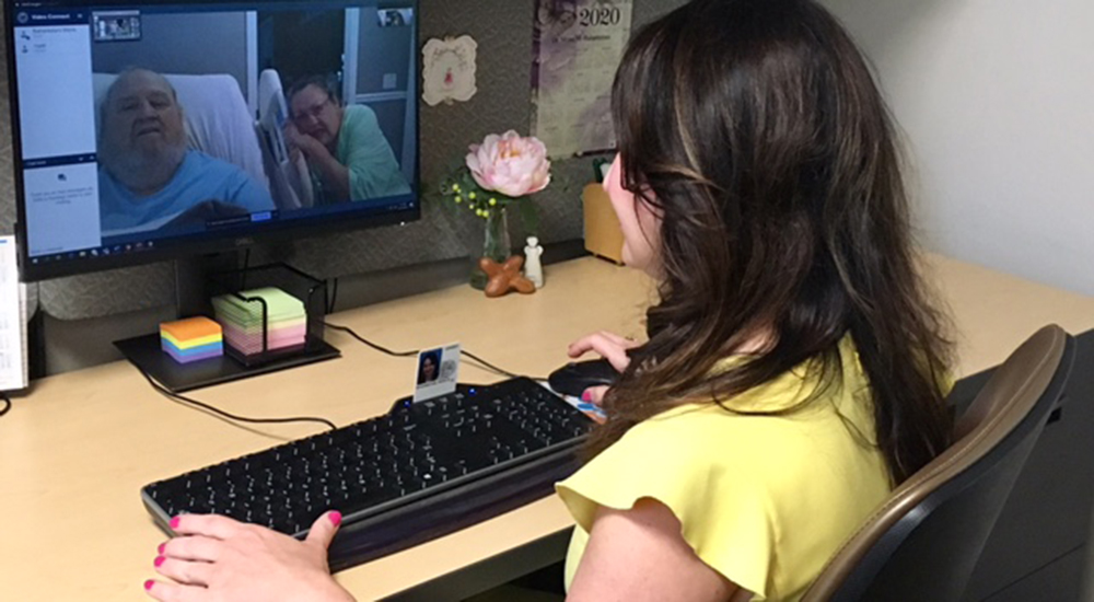 A doctor talks to a Veteran and his wife for a telehealth appointment