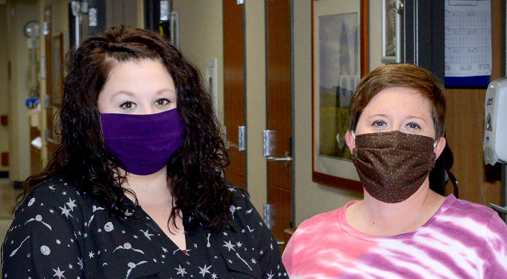 Two nurses who helped patients with a virtual connection