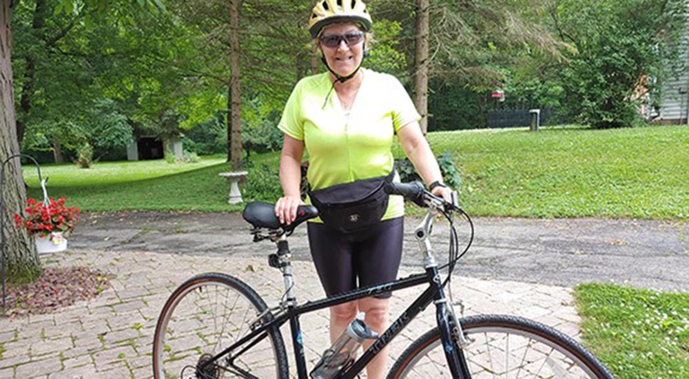 Senior woman with her bicycle