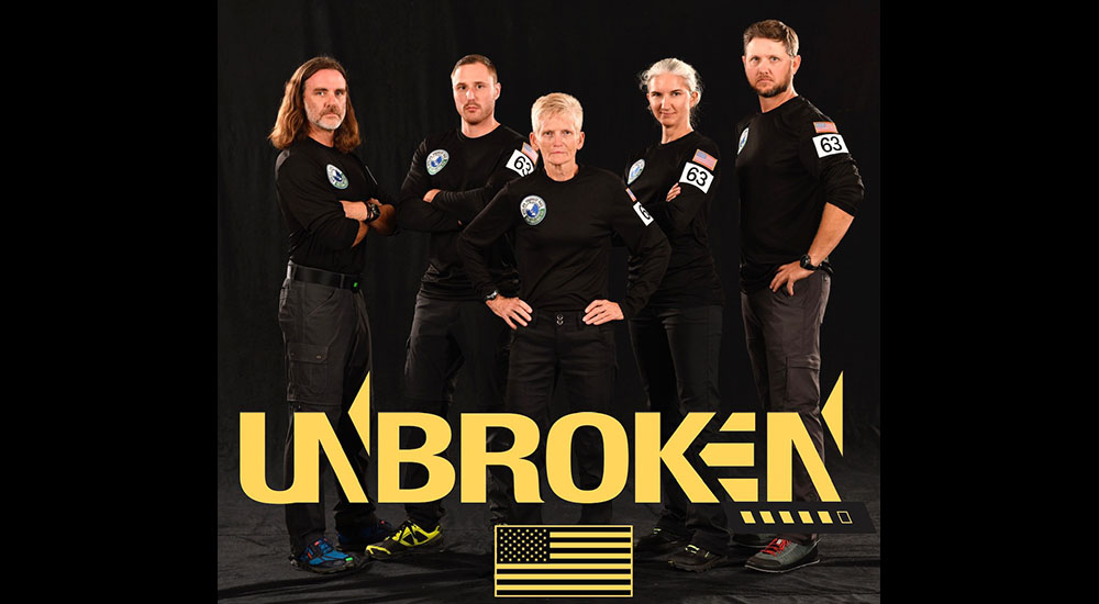 Five people in black uniforms on UNBROKEN poster