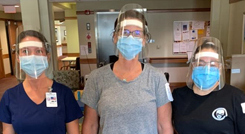 Three nurses wearing masks