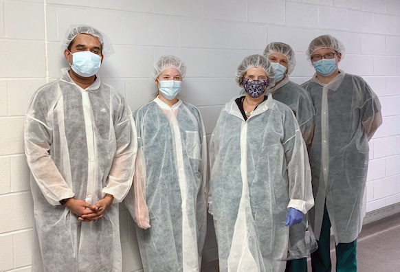 Dr. Kath Bogie's research lab at the VA Advanced Platform Technology Center in Cleveland. Pictured from left to right, Dhruv Seshadri, Katie Schwartz, Kath Bogie, Bryan Hausman, and Jason Collins.