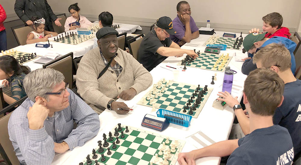 Large group of people playing chess
