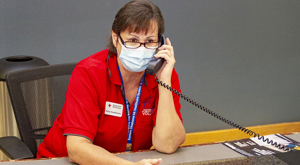 An American Red Cross volunteer on the phone