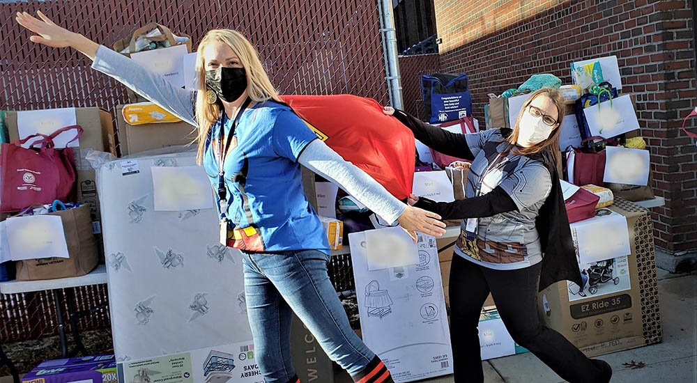 Two women in superhero costumes