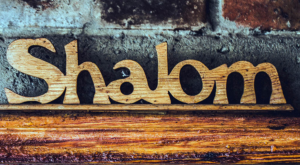 Wood carving of the word Shalom