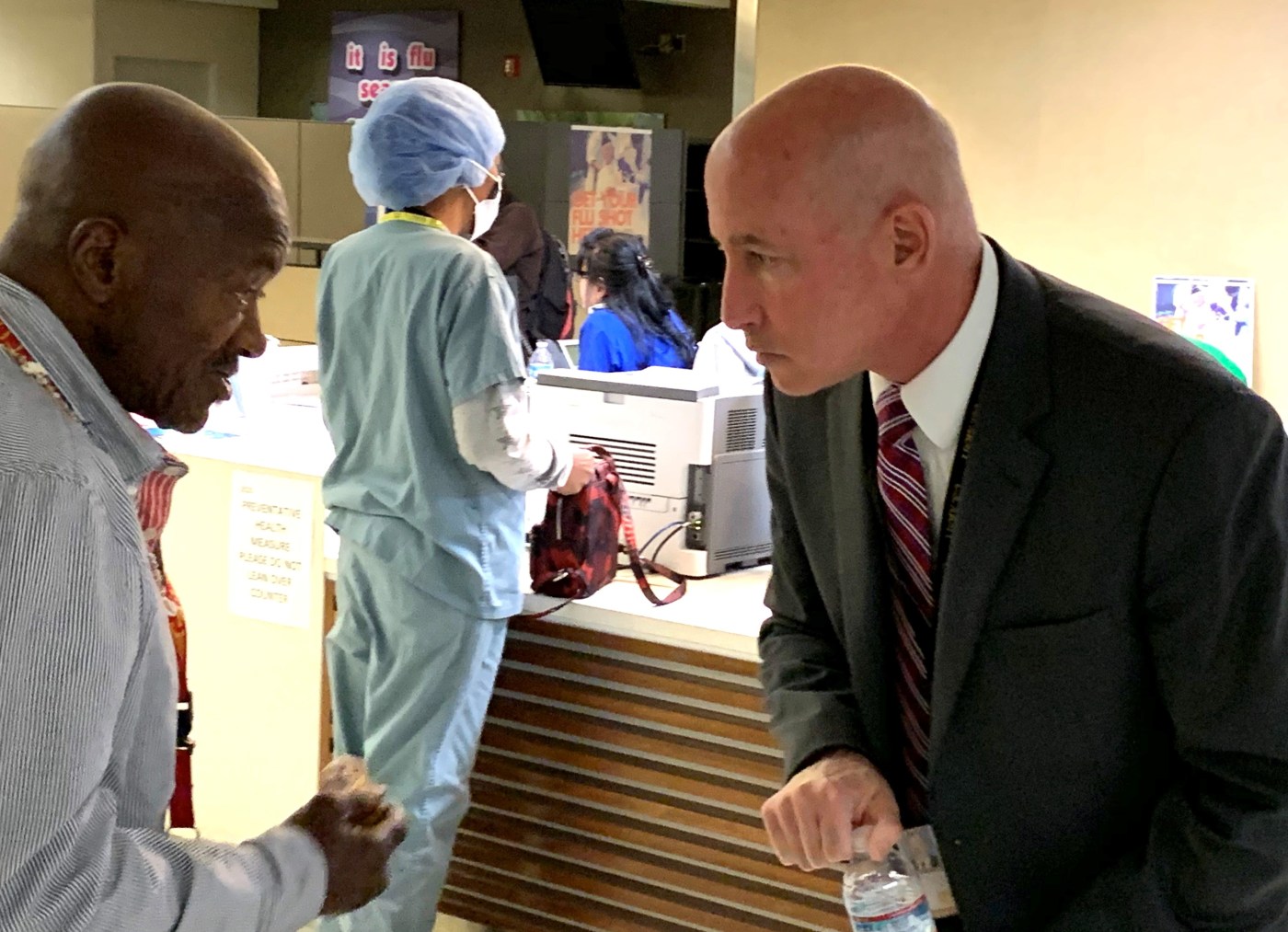 Dr. Steve Braverman (right), director of the VA Greater Los Angeles Healthcare System, speaks with Marine Veteran Jerry Harris about his health care needs.