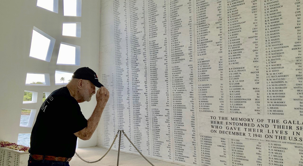 Man saluting names of Pearl Harbor victims