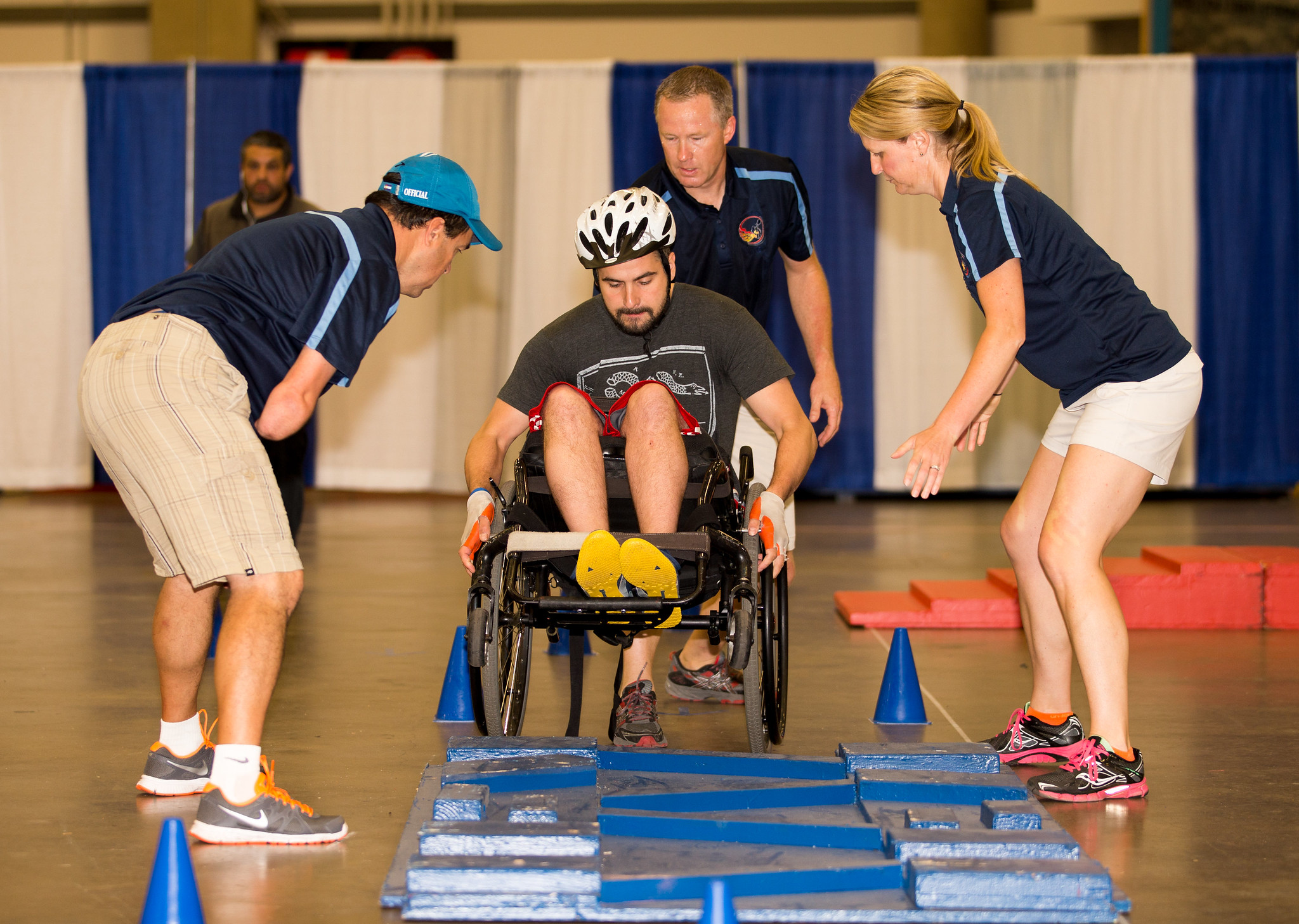 veteran in wheelchair going over obstacle course