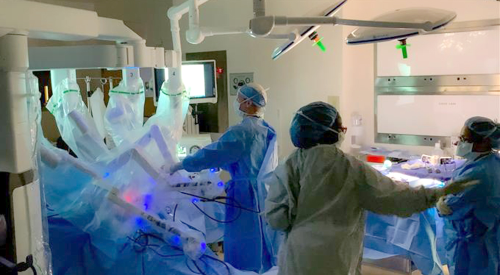 Surgical team prepares robotic minimally invasive surgery.