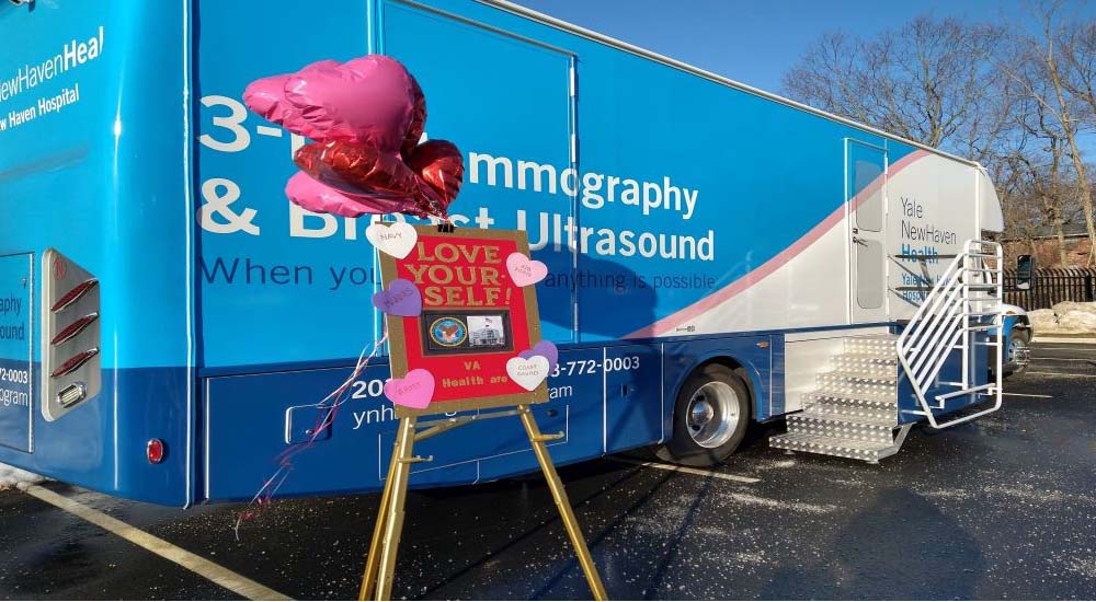 Large mammography bus with welcoming balloons