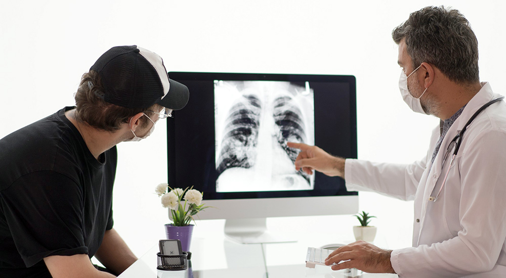 Doctor and patient view lung x-ray