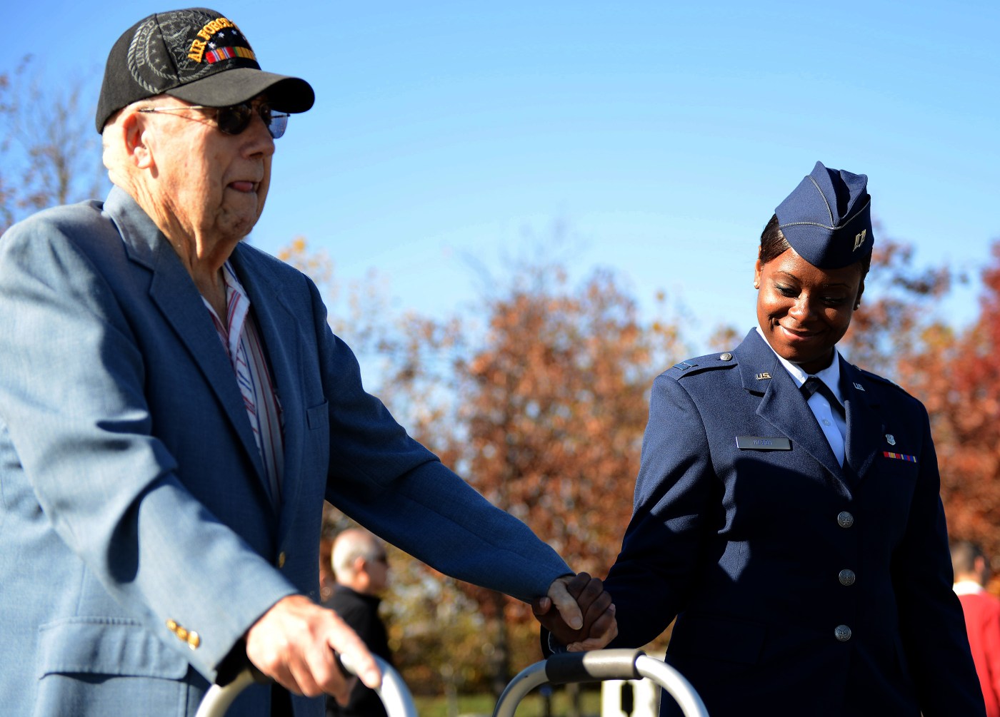 An Air Force Captain escorts an Air Force veteran.