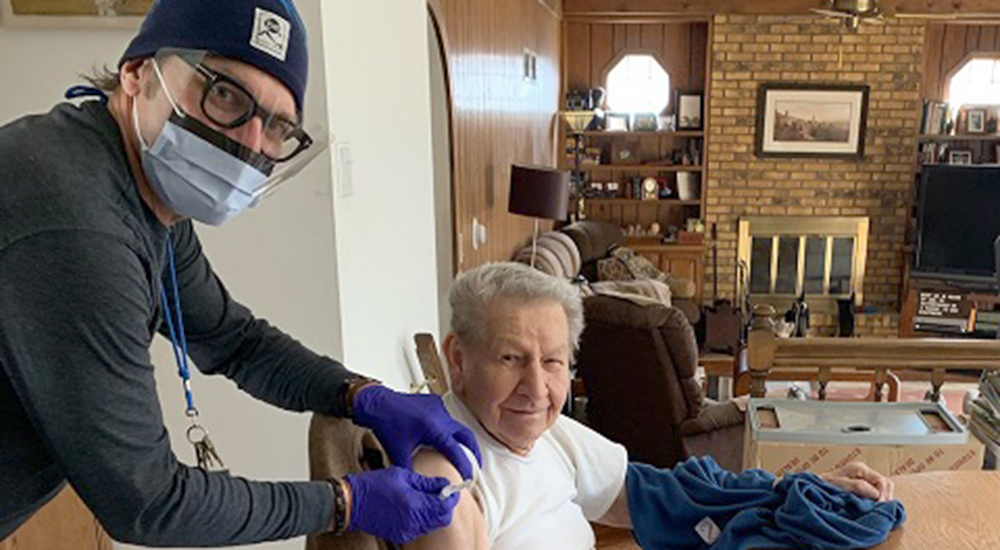 Nurse delivers vaccine shot to elderly Veteran in his home