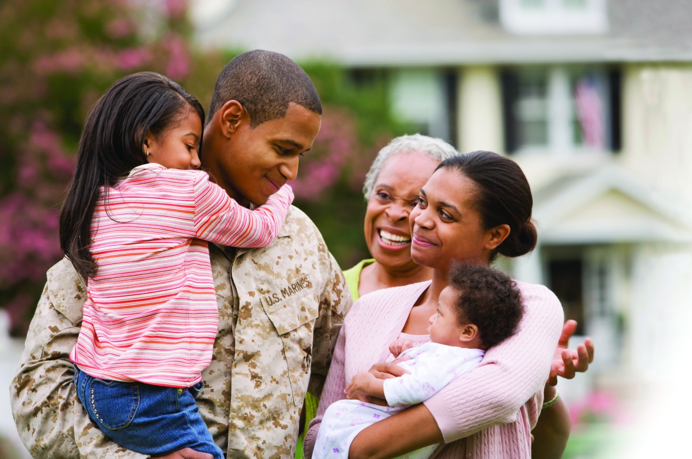 Marine family embraces.