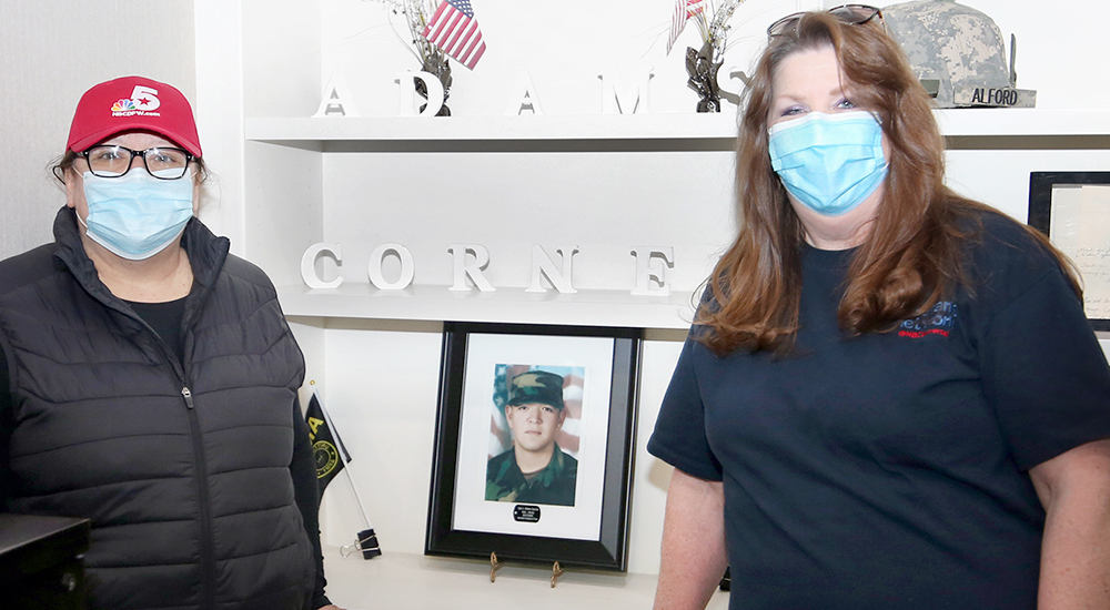 Two women with photo of soldier