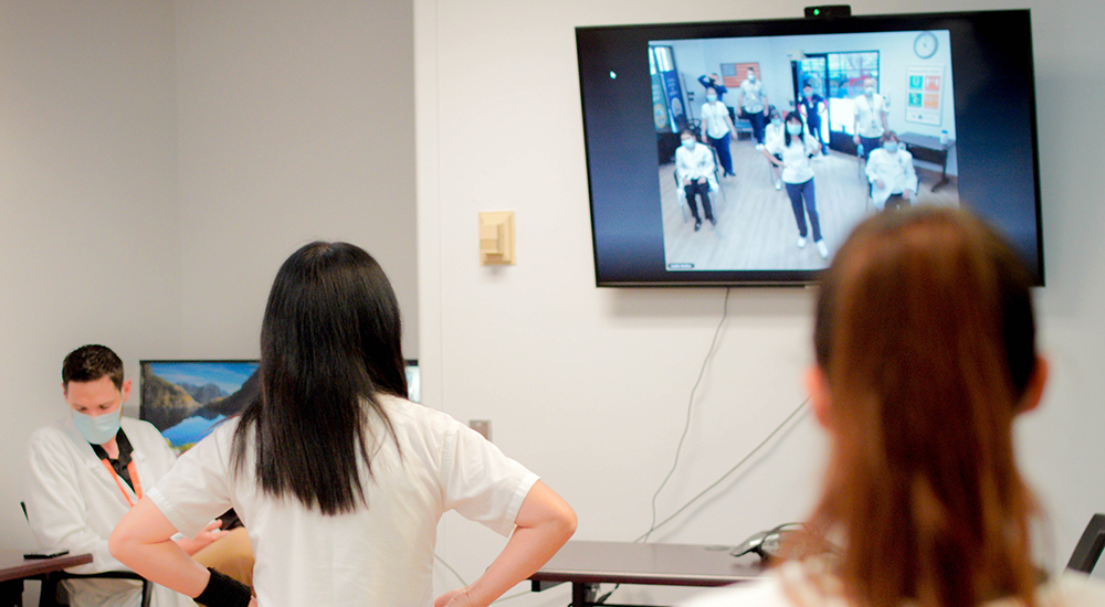 Participants join exercise program on TV monitor