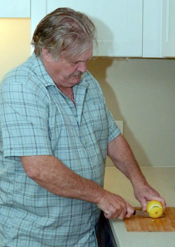 Man cutting a lemon