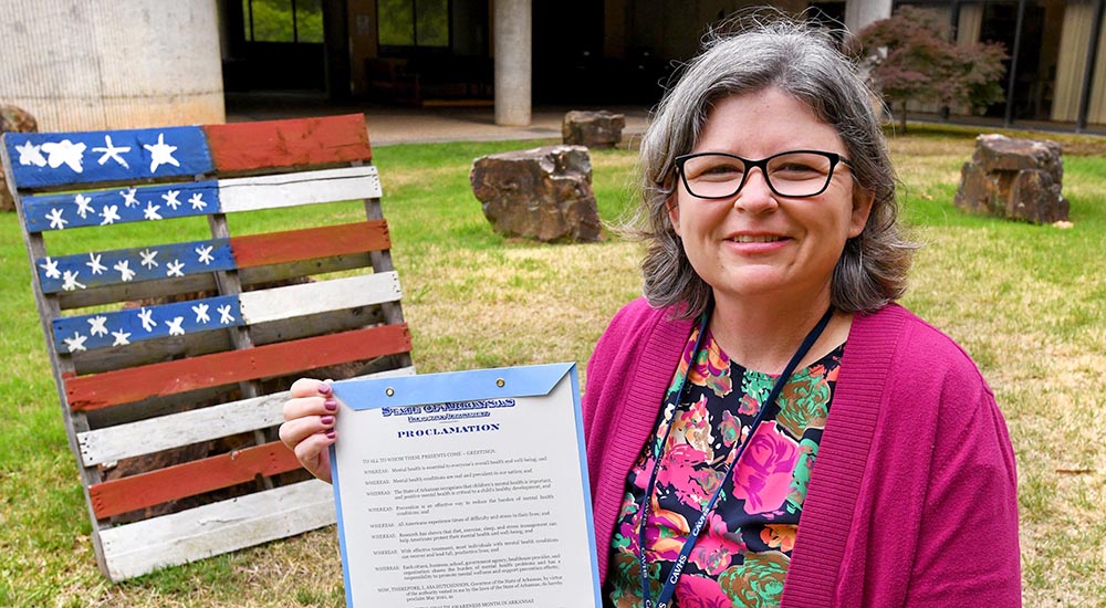 Woman holding official proclamation