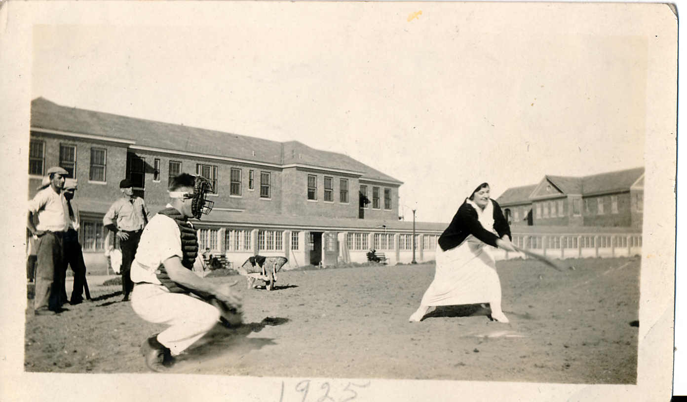 Nurse batting in baseball game in 1925 at Northampton VAMC