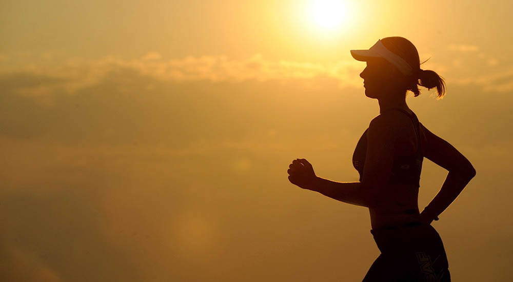 Silhouette of woman jogging