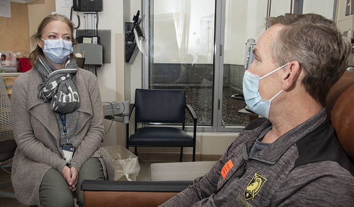 Dr. Julie Graff, an oncologist at the Portland VA, consults with Army Veteran David Atkinson, whose aggressive prostate cancer was treated based on genetic testing.