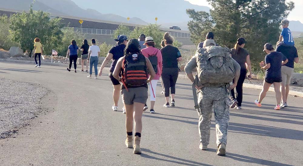 Group of people walking on road for National PTSD Awareness Day