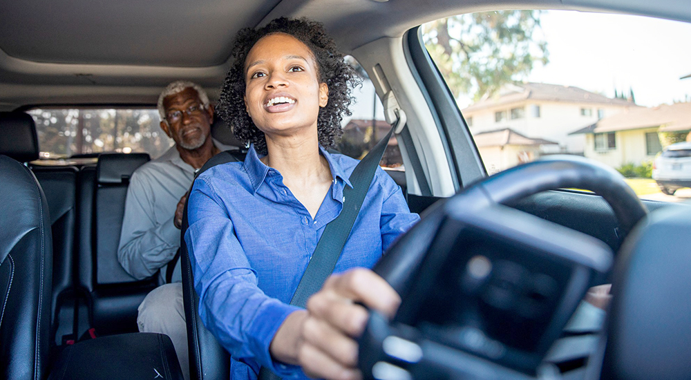 Woman driver talking to passenger