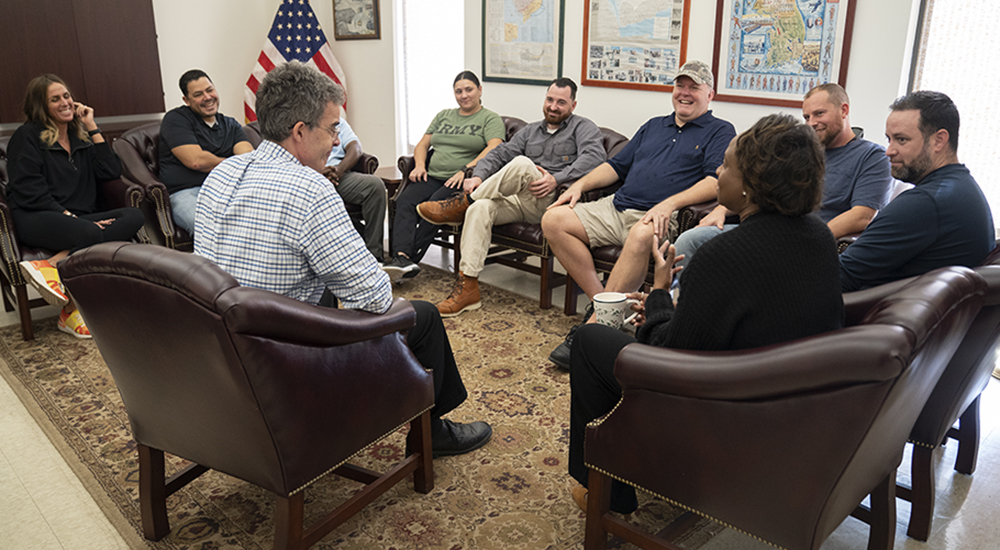 Ten Veterans in a group counseling session