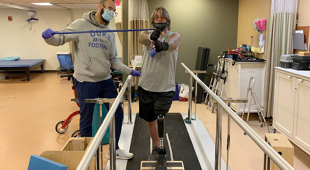 Veteran and therapist working out on treadmill