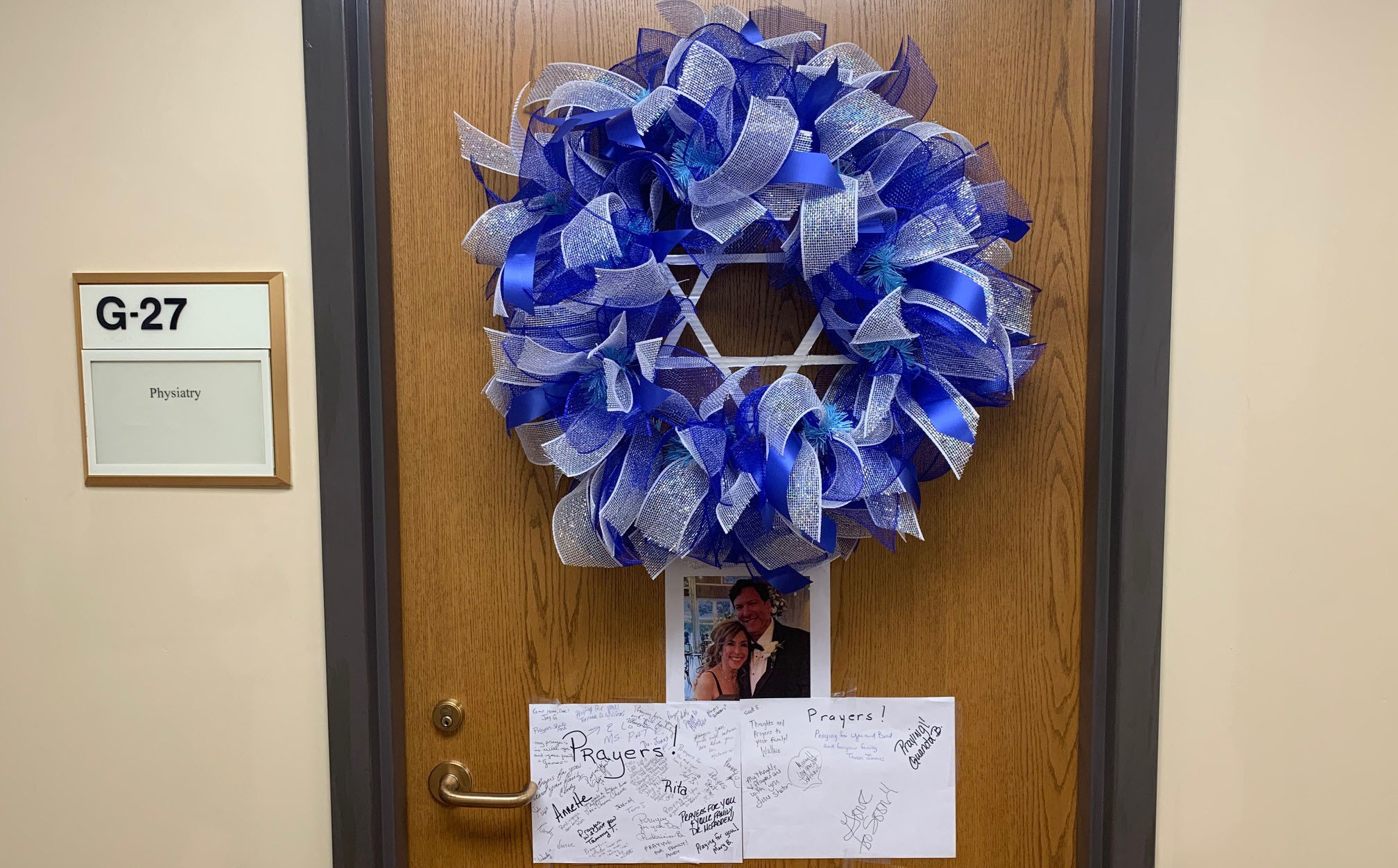 Friends, colleagues, and patients of Dr. Cohen are honoring his memory by posting prayers and condolences on his office door at the Tuscaloosa VA. (Photo by April Jones)