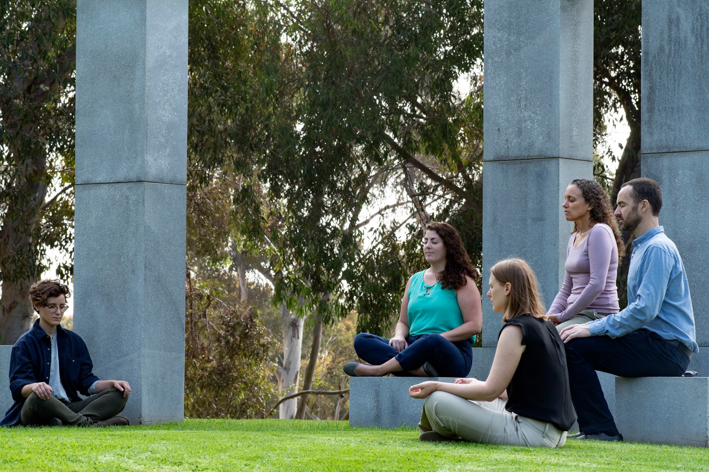 Dr. Ariel Lang (second from right) practices meditation with associates from her lab. She’s focusing on complementary and alternative techniques, such as yoga and meditation, as a therapy for patients with PTSD.