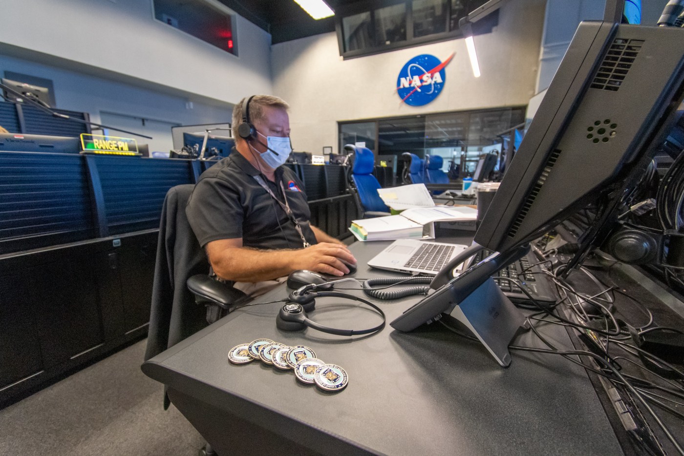 Greg Cusimano works at computer inside NASA’s Range Control Center to help resupply the International Space Station
